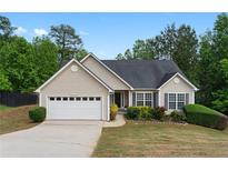 Charming single-Gathering home featuring a two-car garage and well-maintained landscaping at 4219 David Austin Ct, Snellville, GA 30039