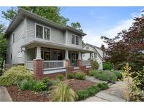 Charming two-story home with a welcoming front porch and professionally landscaped yard at 1066 High Point Ne Dr, Atlanta, GA 30306