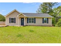 Charming one-story home featuring a well-maintained lawn and classic curb appeal at 159 Cranbrooke Dr, Dallas, GA 30157