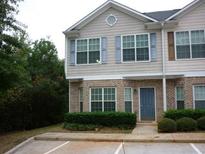 Two-story townhome with brick facade and light-blue shutters at 2502 Walden Lake Dr, Decatur, GA 30035