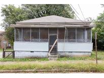 Modest single-story home with screened porch and weathered features, needing renovation at 108 Vine Sw St, Atlanta, GA 30314