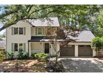 Charming two-story home features a welcoming front porch and attached two-car garage at 1489 Kolb Ridge Sw Dr, Marietta, GA 30008