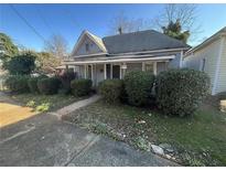 Quaint single-story home with a traditional design and landscaped front yard at 158 Milton Sw Ave, Atlanta, GA 30314