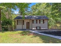 Charming single-Gathering home with a well-maintained front lawn and inviting entrance, perfect for a Gathering at 2496 Shiloh Dr, Decatur, GA 30034