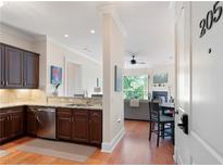Modern kitchen with stainless steel appliances and granite countertops, open to the living area at 351 Washington Ne Ave # 205, Marietta, GA 30060