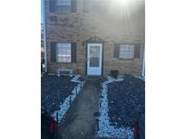 Charming brick home featuring a landscaped walkway and decorative lighting leading to a welcoming front door at 4701 Flat Shoals Rd # 65A, Union City, GA 30291