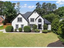 Charming two-story home with landscaped front yard and manicured shrubs at 503 Chatfield Nw Way, Marietta, GA 30064