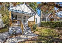 Charming bungalow with a welcoming front porch, painted in neutral colors, and set in a neighborhood setting at 763 Jones Nw Ave, Atlanta, GA 30314