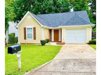 Charming single-Gathering home with well-maintained lawn and attached garage at 3793 Mays Sw Ct, Atlanta, GA 30331
