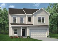 Charming two-story home with a well-manicured lawn and inviting front porch at 379 Morgan Rd, Carrollton, GA 30116