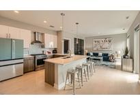 Open concept kitchen with modern appliances, a large island, and seamless flow to the living area at 775 Juniper Ne St # 612, Atlanta, GA 30308
