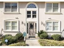 Charming condo building featuring an arched entryway, updated windows, and manicured landscaping at 1538 Chantilly Ne Dr # 224, Atlanta, GA 30324