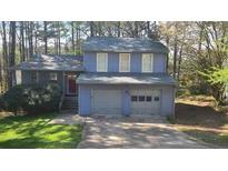 Charming two-story home with an attached two-car garage and well-kept front lawn at 783 Fox Valley Dr, Stone Mountain, GA 30088