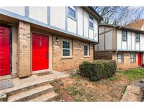Inviting townhome with a bright red front door and well-maintained brick facade at 1150 Rankin St # 6H, Stone Mountain, GA 30083