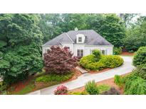 Charming home with a well-manicured front yard, colorful landscaping, and a private driveway at 2695 Rangewood Ne Dr, Atlanta, GA 30345