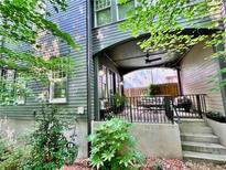 Inviting covered front porch with comfortable seating and stylish railing, perfect for relaxing outdoors at 262 Southerland Ne Ter, Atlanta, GA 30307