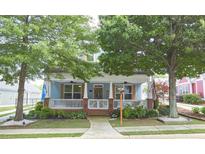Charming home with a welcoming front porch and mature trees, offering curb appeal at 230 Ryan Ln, Covington, GA 30014