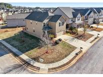 Beautiful two-story home featuring manicured landscaping, a covered front porch, and an attached two-car garage at 2528 Shropshire Pl, Mcdonough, GA 30253