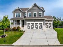 Beautiful two-story home with gray siding, white trim, and well-manicured lawn at 17 Ridgeline Nw Way, Cartersville, GA 30121