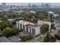 Beautiful aerial view of multi-story apartment building nestled among lush green trees in a vibrant city setting at 525 Parkway Dr Ne # 305, Atlanta, GA 30308