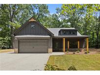 Charming craftsman-style home with a two-car garage and inviting front porch at 1687 Harmony Rd, Temple, GA 30179