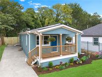 Charming bungalow with inviting front porch and meticulously landscaped front yard offers great curb appeal at 75 Mayson Ne Ave, Atlanta, GA 30307