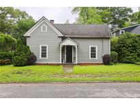 Charming one-story home with a welcoming front porch and well-maintained lawn at 1096 Tilden Nw St, Atlanta, GA 30318