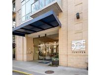 Exterior building entrance featuring a covered entryway and glass doors at 905 Ju Ne Street Ne St, Atlanta, GA 30309