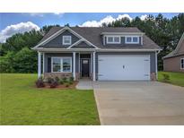 Charming home featuring a two-car garage and welcoming front porch at 109 Sunflower Ne Cir, Cartersville, GA 30121