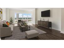 Bright living room features large windows with scenic views and contemporary decor at 3475 Oak Valley Rd # 1850, Atlanta, GA 30326