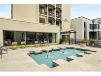 Beautiful condo building exterior with water feature and outdoor seating area at 1421 Peachtree Ne St # 203, Atlanta, GA 30309