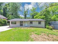 Charming single-story home with a well-maintained lawn and a fresh exterior paint job at 2317 Baywood Se Dr, Atlanta, GA 30315