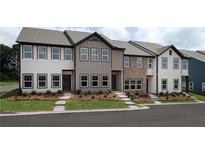 New townhomes displaying multiple designs and colors with professionally landscaped yards at 5108 Arista Dr, Douglasville, GA 30135