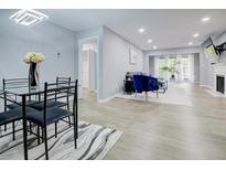 Bright living room with fireplace, open floor plan, and recessed lighting, blending comfort and style at 24317 Plantation Ne Dr, Atlanta, GA 30324