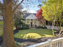 Charming traditional home with a columned porch and well-maintained front yard at 582 Lakeshore Ne Dr, Atlanta, GA 30307