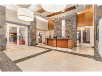 Inviting lobby featuring stone accents, a reception desk, and tile flooring at 3300 Windy Ridge Se Pkwy # 718, Atlanta, GA 30339