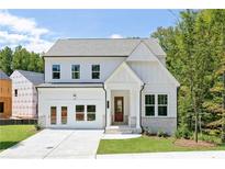 Charming two-story home with white siding, a red front door, and a well-manicured lawn at 3062 Cambridge Mill St, Acworth, GA 30102