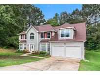 Charming two-story home featuring a two-car garage and well-maintained landscaping at 4615 Thermal Ct, Douglasville, GA 30135
