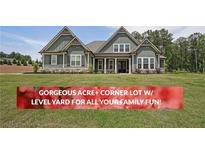 Charming two-story home with an acre of level yard and craftsman-style details at 485 Discovery Lake Dr, Fayetteville, GA 30215