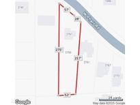 This real estate property features a unique lot map, offering insight into the parcel's dimensions and positioning in relation to the road at 2755 Pharr Ne Rd, Atlanta, GA 30317