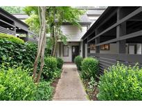 Inviting front entrance with a walkway lined with lush greenery leading to the front door at 76 Forrest Pl, Atlanta, GA 30328