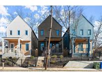 Street view of modern homes with charming front yards and unique architectural details at 988 Mcdaniel Sw St, Atlanta, GA 30310