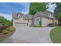 Stately two-story home featuring manicured landscaping and a spacious driveway at 4566 Fountain Ne Dr, Marietta, GA 30067