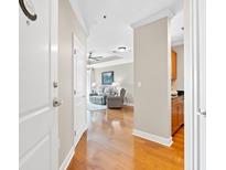Open-concept living room featuring hardwood floors, neutral walls and modern furnishings at 325 E Paces Ferry Rd # 2003, Atlanta, GA 30305