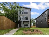Charming two-story home featuring a modern design and beautifully landscaped front yard with a nice walkway at 101 Fairfield Ct, Atlanta, GA 30314
