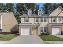 Charming townhouse with a single-car garage and meticulously maintained lawn at 4139 Magnolia Glen Walk, Norcross, GA 30093