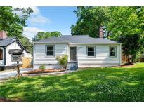 Charming single-story home featuring a well-manicured lawn and inviting front entrance at 1849 Broad Ave, Atlanta, GA 30344