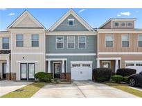 Charming townhome with a one-car garage and a well-maintained lawn at 2656 Avanti Way, Decatur, GA 30035