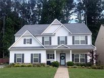 Charming two-story home with a manicured lawn and a welcoming front porch at 336 Parc Xing, Acworth, GA 30102