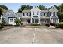 Charming townhome with manicured landscaping and ample parking at 1002 Saddle Hl, Marietta, GA 30068
